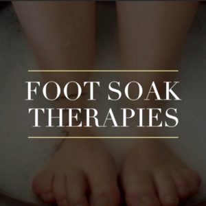 image of feet in a foot soak bowl with acupuncture treatment